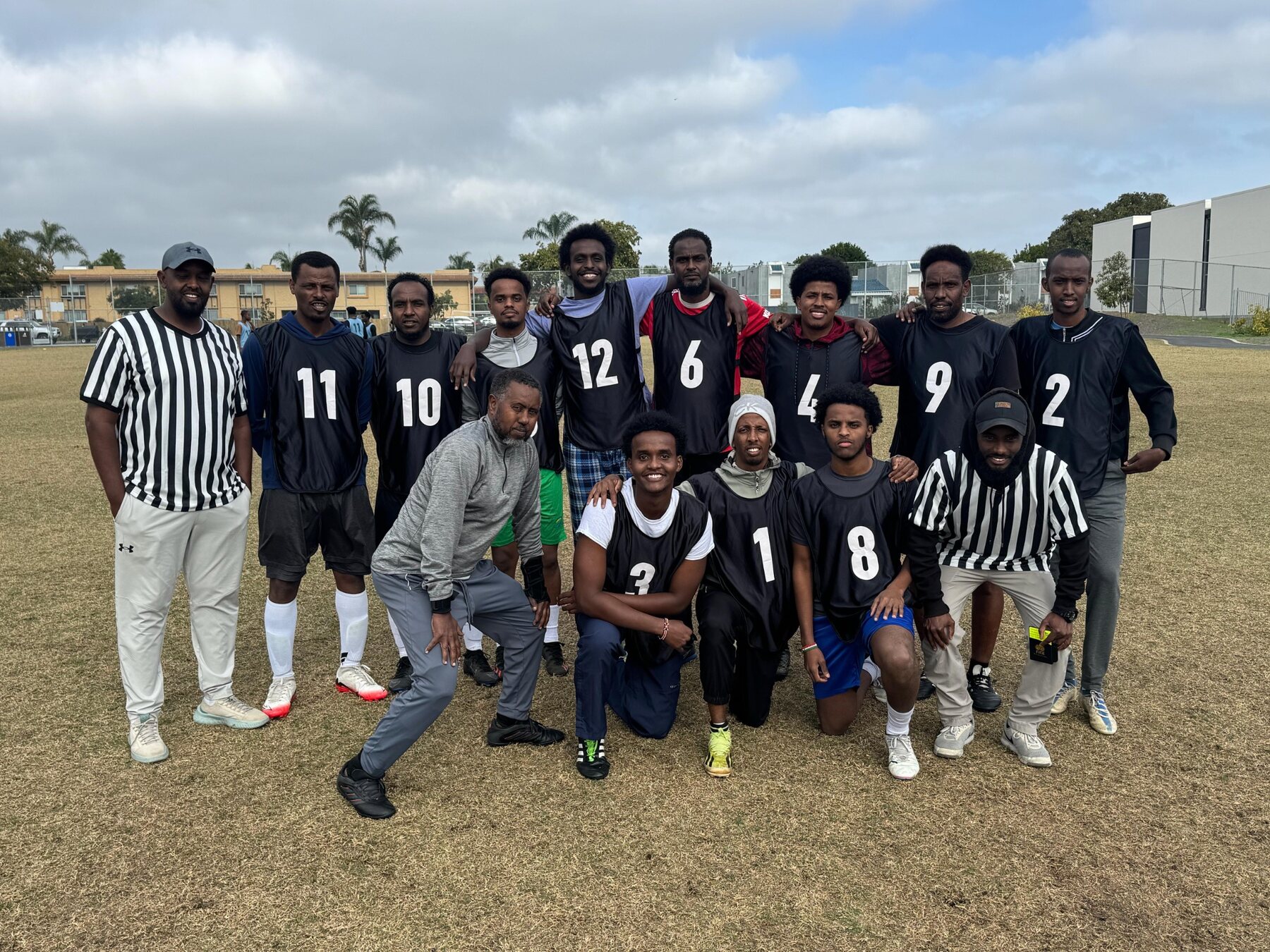 Black tournament team with an official