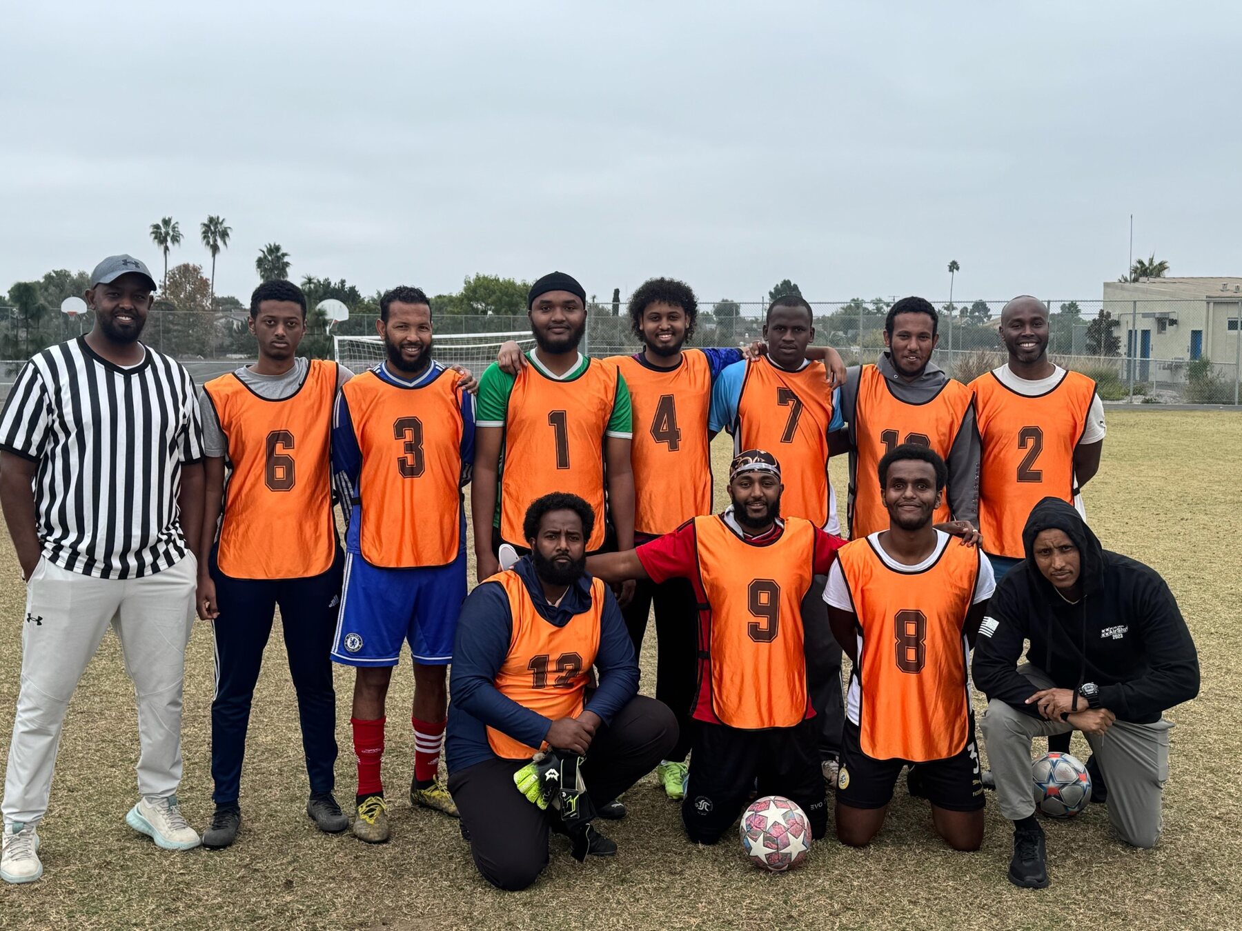 Orange tournament team with officials